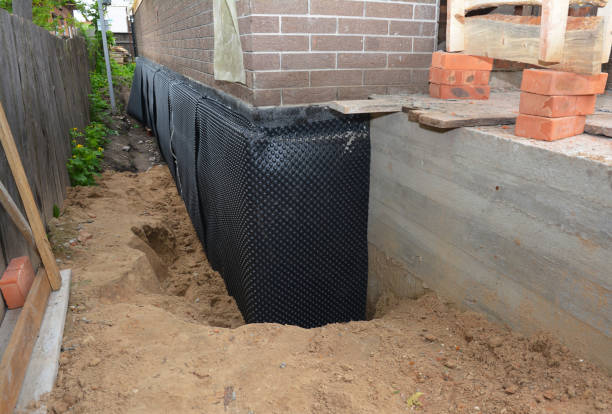 Happy homeowners after waterproofing job in Marengo